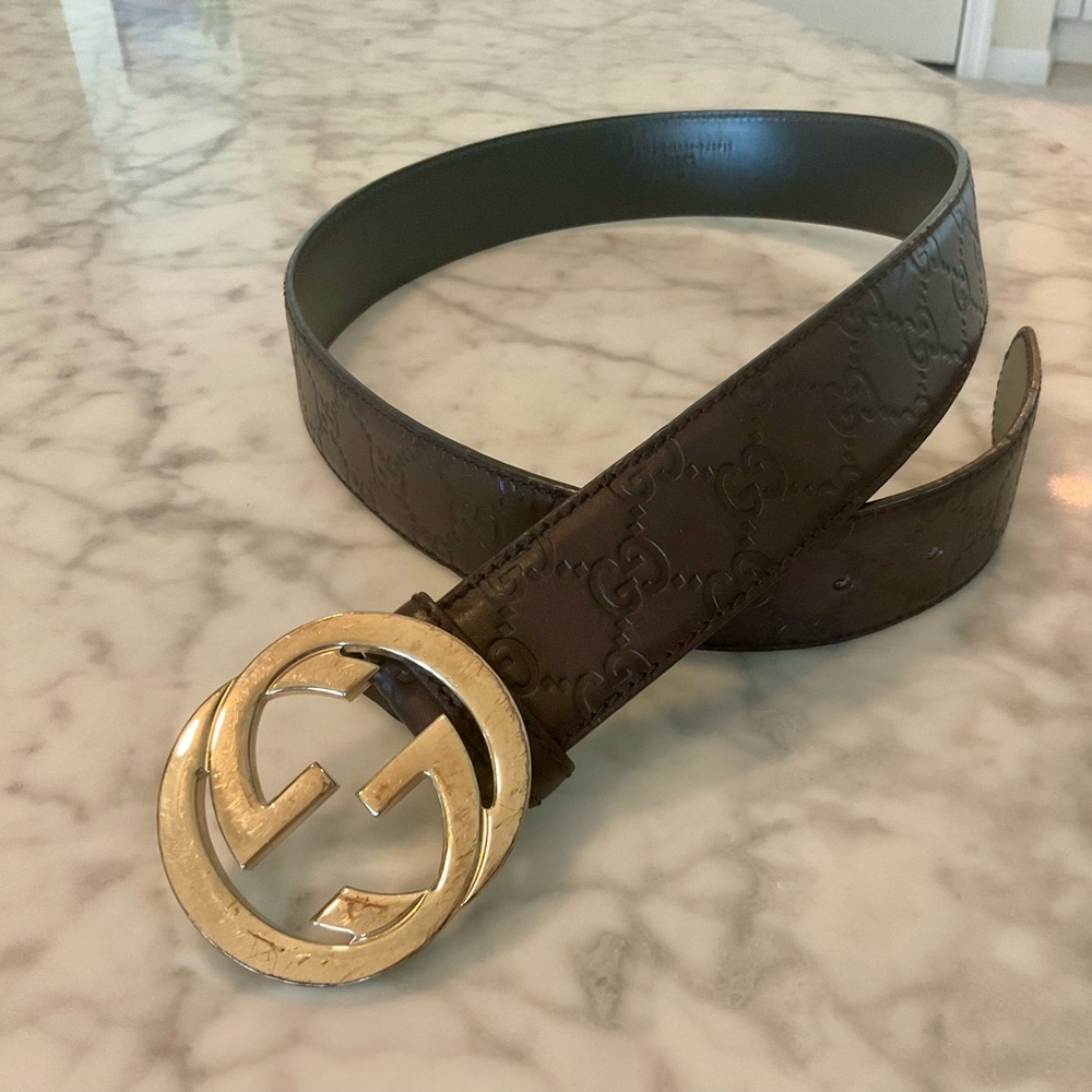 Gucci brown leather belt with
Gold buckle